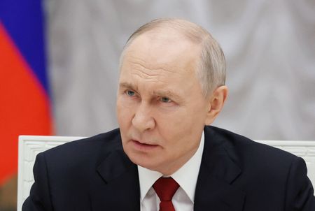 Russia's President Putin meets with service members in Moscow