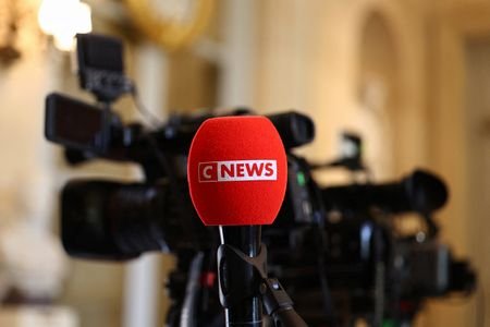 The logo of CNEWS on a microphone at the National