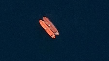 A satellite image of side-by-side ships at sea, off the