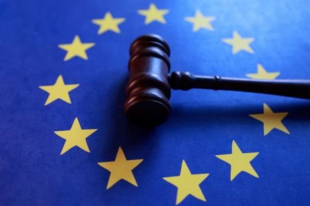 Illustration shows EU flag and court gavel