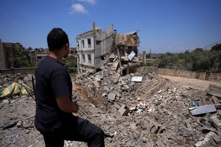 People inspect the damage in the Nabatieh district