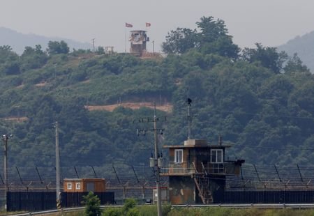 FILE PHOTO: A North Korean soldier stands guard at his