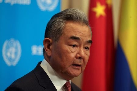 FILE PHOTO: Chinese Foreign Minister Wang Yi speaks with the