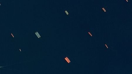 A satellite image of side-by-side ships at sea, off the