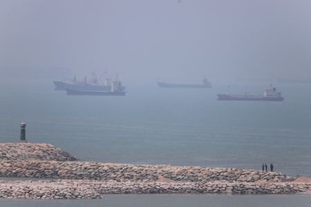 Vessels in the Strait of Hormuz near the beach of
