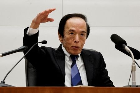 FILE PHOTO: Bank of Japan Governor Kazuo Ueda attends a