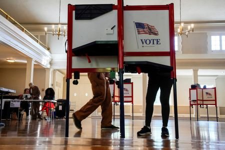 FILE PHOTO: People vote during the primary election for U.S.