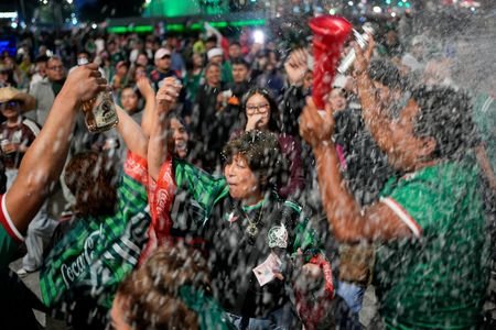 FILE PHOTO: Fans celebrate after the 2026 FIFA World Cup