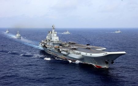 FILE PHOTO: China's aircraft carrier Liaoning takes part in a