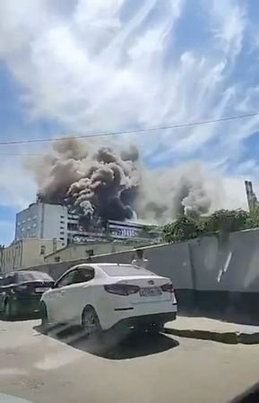 Smoke billows from a production plant following a Ukrainian attack,