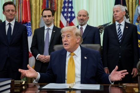 U.S. President Trump signs an executive order in the Oval