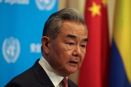 Chinese Foreign Minister Wang Yi speaks with the media at