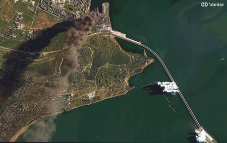 Satellite image shows burning oil storage tanks and smoke rising