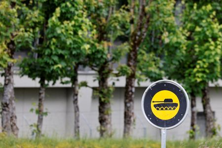 A sign stands at a Swiss army base in Bure
