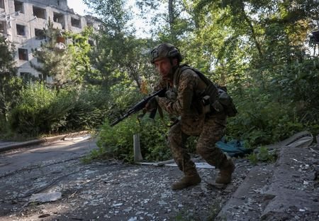 Ukrainian servicemen in the frontline town of Dobropillia