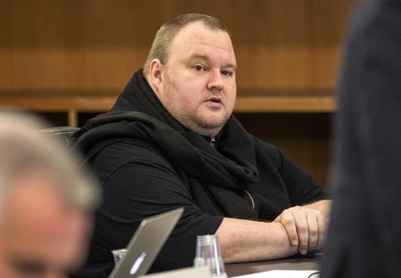 FILE PHOTO: Kim Dotcom sits in a chair during a