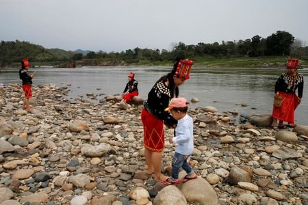 FILE PHOTO: Ethnic Kachin people visit Myitsone, the confluence of