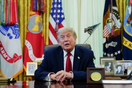 U.S. President Donald Trump signs an executive order in the