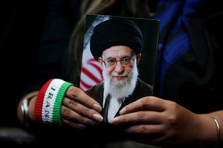 FILE PHOTO: People attend a rally in Tehran