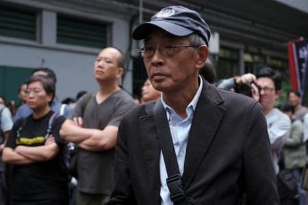 FILE PHOTO: Bookseller Lam Wing-kee marches during a protest to
