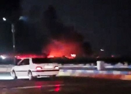 Smoke rises from a fire after an explosion, amid reports