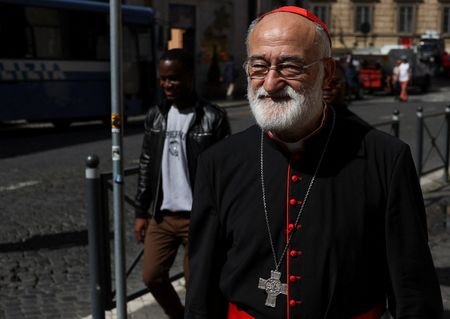 Cardinal Cristobal Lopez Romero walks in Rome