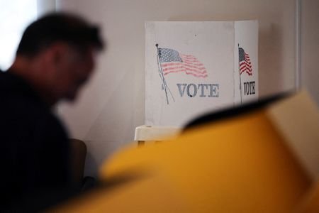 FILE PHOTO: A man votes on a voting machine at