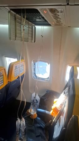 Ryanair passenger partially sucked out of window on flight from Greece