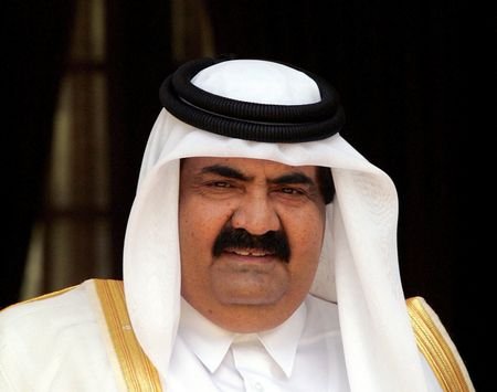 FILE PHOTO: The emir of Qatar, Sheikh Hamad, looks on