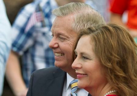 U.S. Republican presidential candidate Graham stands with his sister Darline