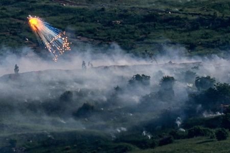 FILE PHOTO: An explosion of what appears to be white