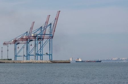 FILE PHOTO: A cargo vessel leaves a port in the