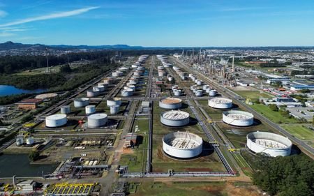 A drone view shows storage tanks and processing units at