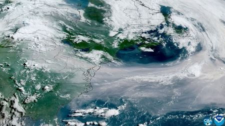 A satellite image shows lingering smoke from Canadian wildfires over