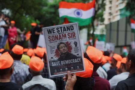 A supporter of the Cockroach Janta Party (CJP) holds a