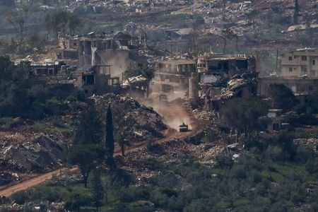 FILE PHOTO: Israeli military vehicles drive in Lebanon, as seen