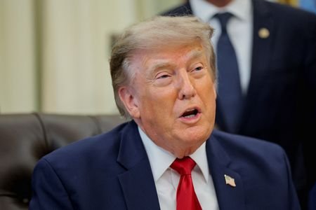 U.S. President Donald Trump signs an executive order in the