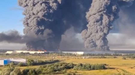 Smoke billows from a warehouse, after deadly Ukrainian drone attacks,