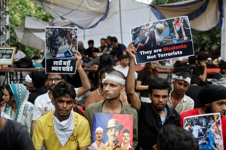 Supporters of India's Cockroach Janta Party (CJP) react at a