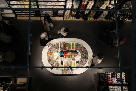 People gather in the Crocs store in a shopping mall