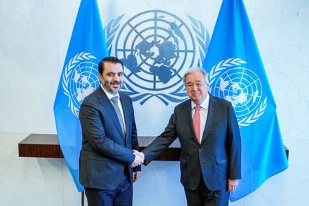 FILE PHOTO: Syrian Foreign Minister Asaad Hassan al-Shaibani shakes hands