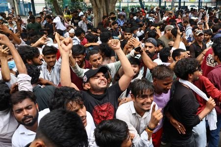 Supporters of India's Cockroach Janta Party (CJP) celebrate after India’s