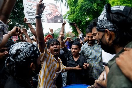Supporters of India's Cockroach Janta Party (CJP) celebrate after India's