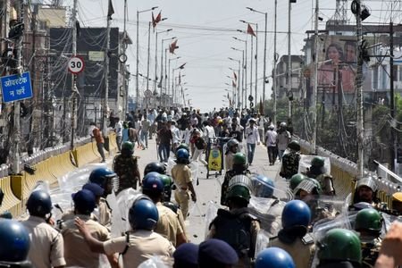 Protesters engage in a clash with policemen during Bihar Bandh
