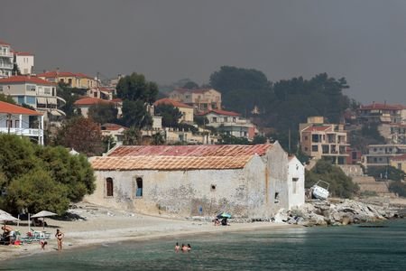 Three Greek firefighters killed as wildfires strike further east in Europe