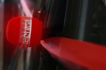The logo of CNEWS on a microphone at Paris courthouse