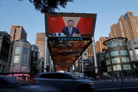 FILE PHOTO: Giant screen shows news footage of the third