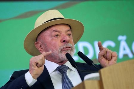 FILE PHOTO: Brazil's President Luiz Inacio Lula da Silva signs