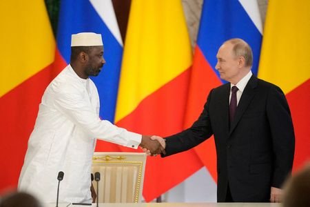 FILE PHOTO: Russian President Vladimir Putin meets with Interim President