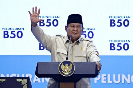 Indonesian President Prabowo Subianto gestures during a ceremony,